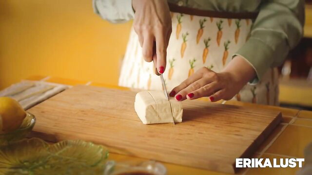 Mercè Palau cutting tofu in apron, Erika Lust porn for women