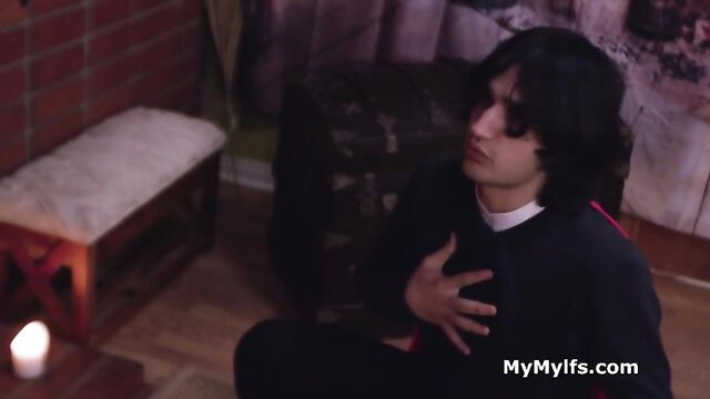 Prince Yahshua as priest kneels aroused in magic mirror queen scene