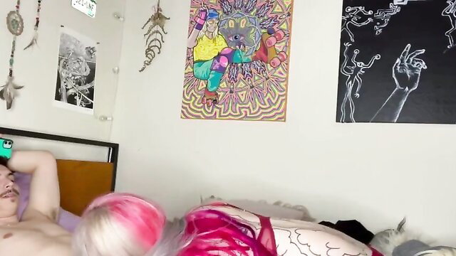 Pink-haired alternative tranny nude on bed showing cock