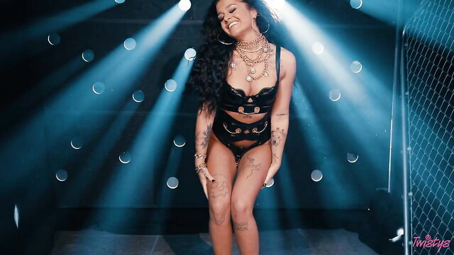 Ryan Reid dances seductively in black lingerie, teasing curves