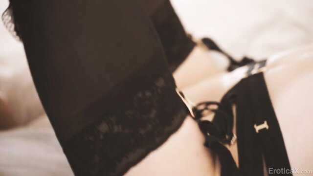 Evelyn Claire in sexy black lingerie and stockings closeup