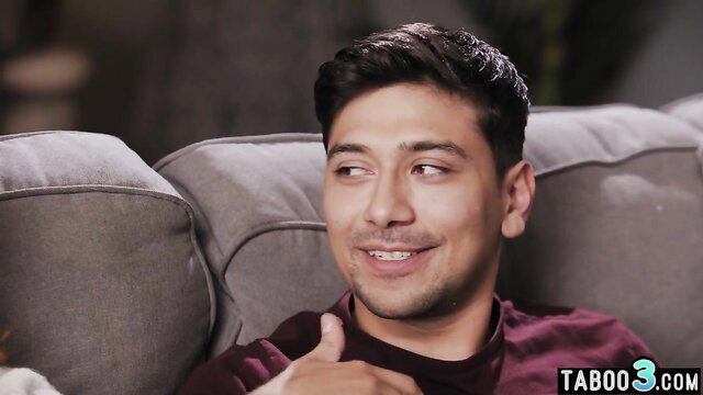 Handsome Latino teen bro smiling on couch in taboo stepsis video