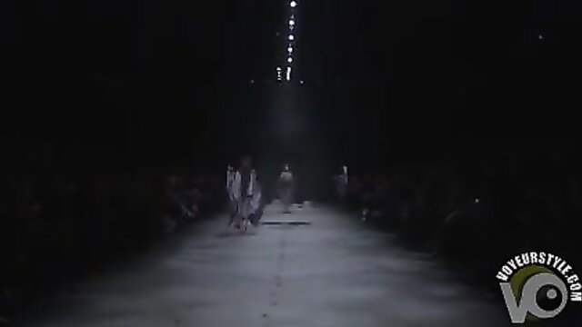 Nude models with wet breasts and crotches strutting fashion catwalk