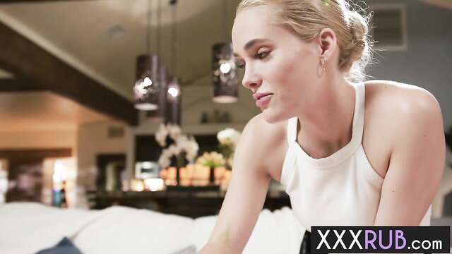 Lauren Phillips in white halter top on bed, lesbian massage tease