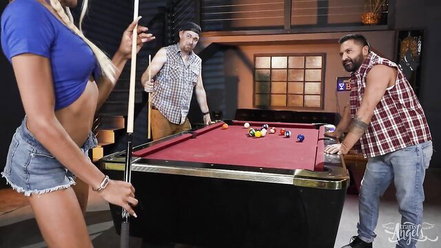 Hot blonde tranny in tiny shorts holds pool cue with horny studs