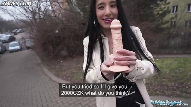 Asian babe in white coat holds huge pink dildo outdoors, deepthroat tease