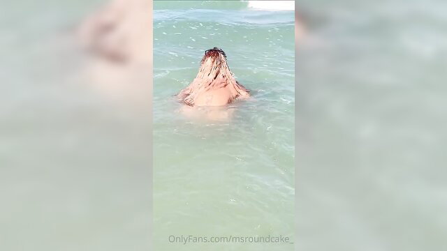 SANDY CHEEKZ wet blonde submerged in turquoise ocean water