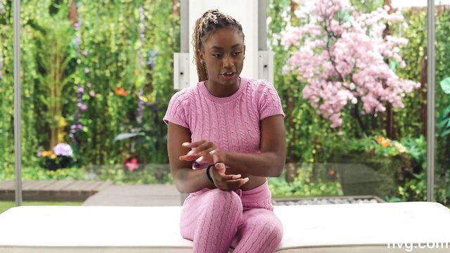 Curvy black amateur babe in tight pink knit outfit posing seductively