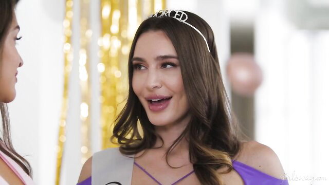 Ella Reese crowned beauty queen smiling with Gizelle Blanco at party