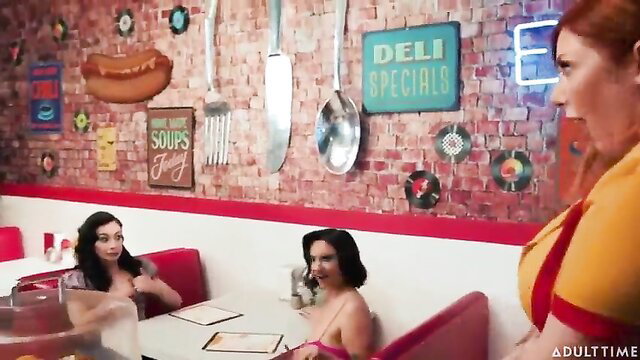 Redhead waitress serves busty brunettes in hot diner 3some