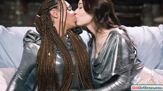 Eva Maxim and Emma hot tgirls kissing passionately in shiny latex outfits