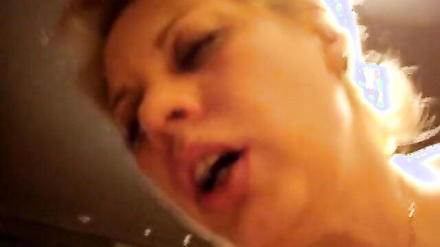 Blonde MILF with open mouth in intense close-up POV blowjob