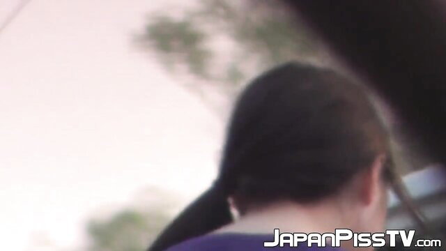 Japanese babe in purple top wetting pants accidentally outdoors