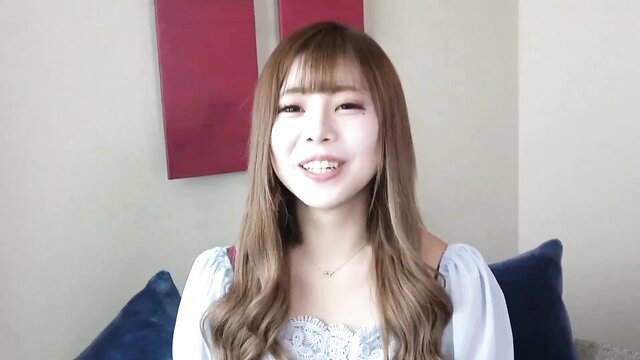 Pretty Asian amateur babe with bangs smiling in blouse closeup