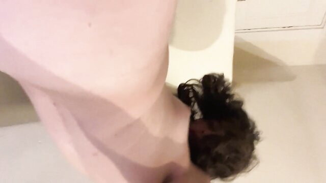 Cute t-girl with curly hair squats nude over toilet, explicit ass view