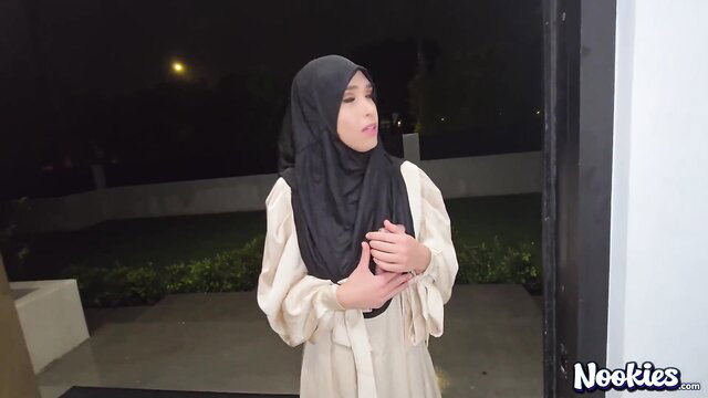 Muslim woman in hijab looking surprised