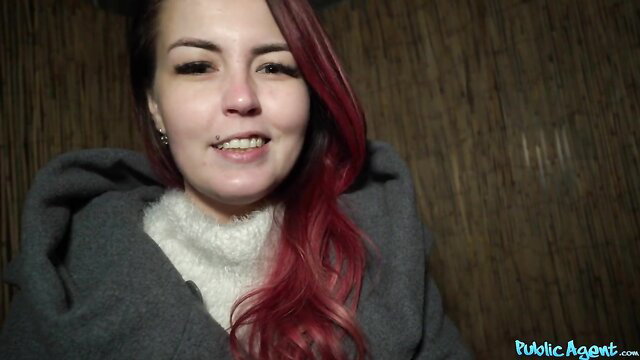 Redhead Cindy Shine smiles in hoodie, closeup face view