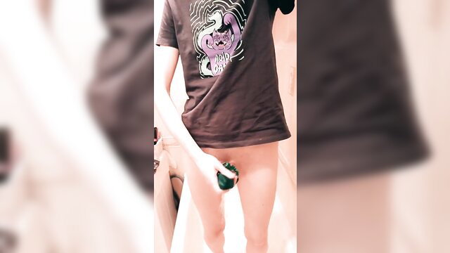 Blurry guy in graphic tee gives rigid sock handjob, exposed cock