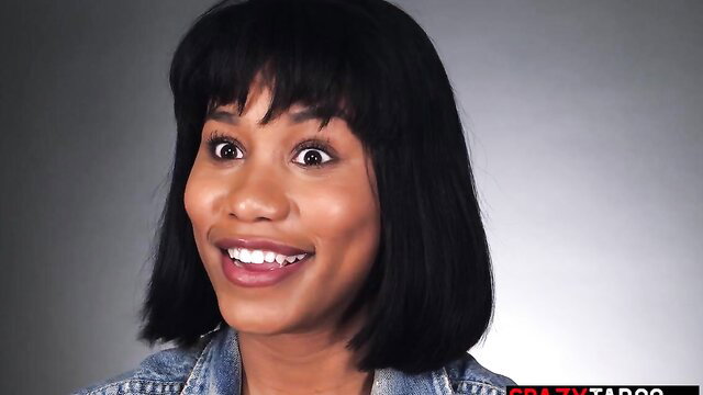 Smiling beautiful black mom with bangs in denim jacket closeup