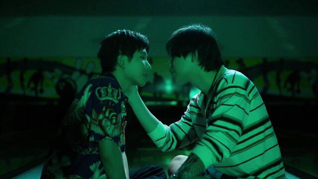Two handsome Asian guys in intimate close-up kiss, neon-lit gay BL scene