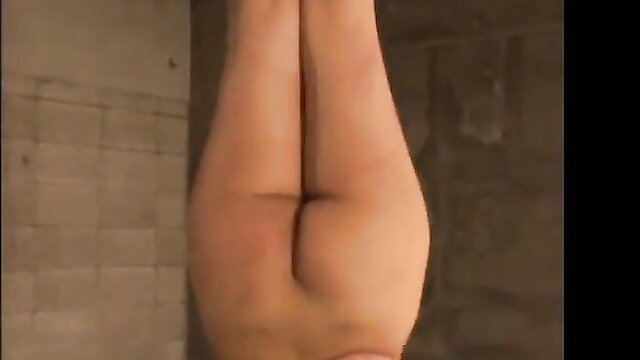 Sexy slut hangs upside down in shower, nude ass and legs spread wide