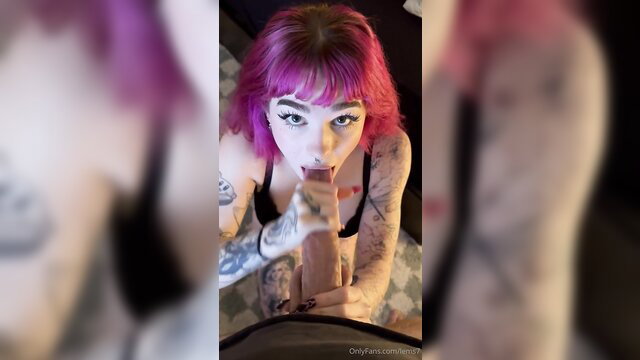 Pink-haired tattooed girl gives intense POV blowjob closeup