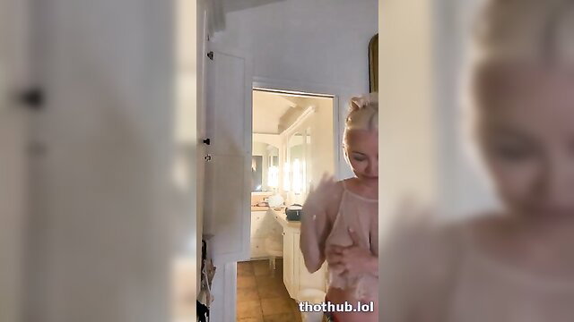 Lindsey Pelas topless in bathroom doorway, huge tits tease OnlyFans live