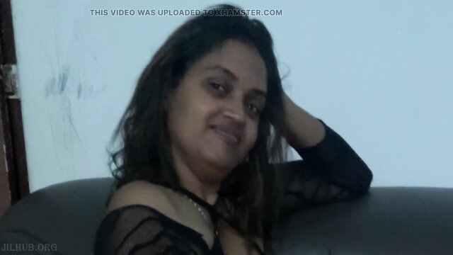 Smiling Sri Lankan beauty in sheer black lingerie, hand on head pose
