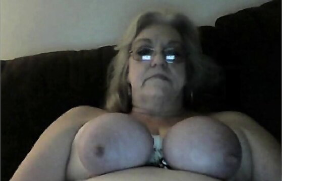 Addicted grannie with huge sagging tits exposed on couch