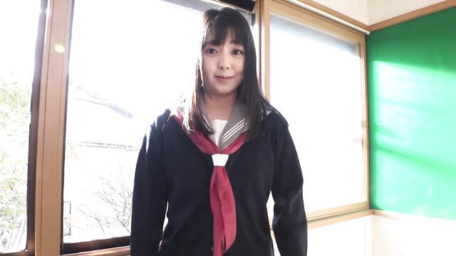 Cute Japanese schoolgirl Roman Izumi in sailor uniform smiling