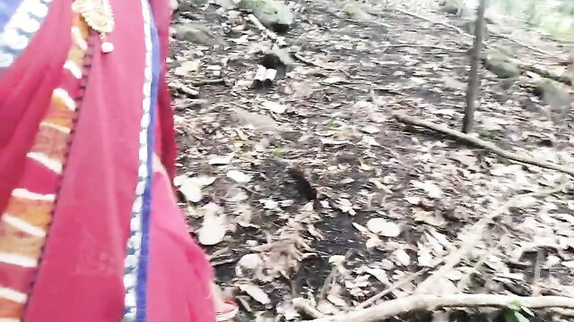 Desi bhabhi in red saree walking in forest, outdoor tease