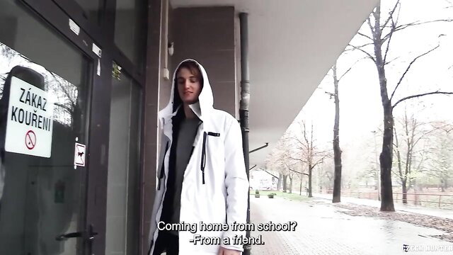 Fashionable hooded stud coming home from school kneels ready for action