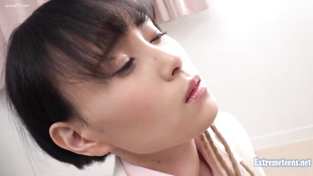 Kudou Rara JAV teen closeup face tilt glossy lips pink blouse