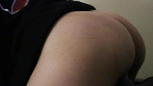 Closeup of thick white girl's pale round ass shaking in black top