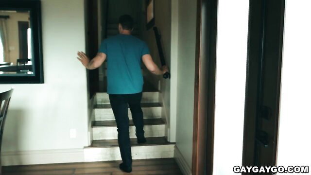 Hoss Kado walking upstairs in tight tee and jeans, hot gay tease