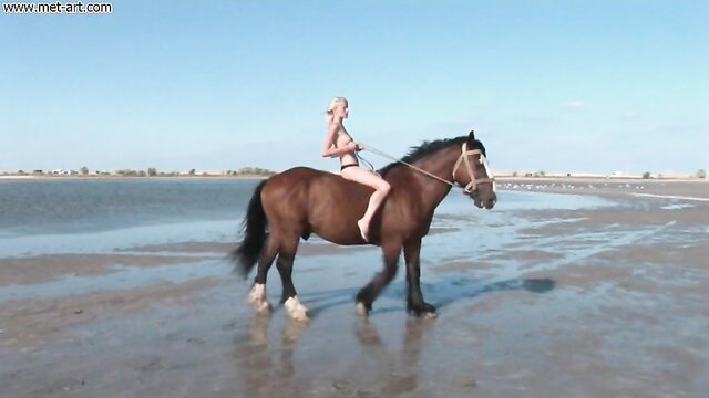 Mila I nude on horse at beach in MetArt VEMISS