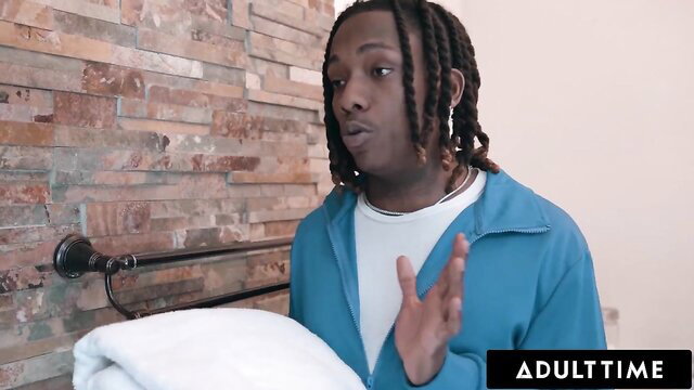 Playboi Carti lookalike footballer with towel in shower, Adult Time