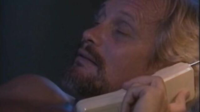 Blonde bearded man on phone in classic 1992 German porn 'Meine feuchte Rache'