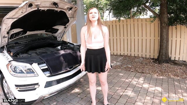 Skinny teen Harlow West poses sexy by car in mini skirt top