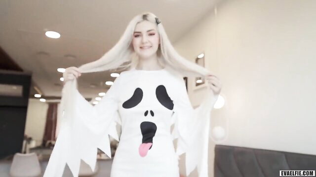 Eva Elfie in sexy ghost Halloween costume, blonde busty beauty posing