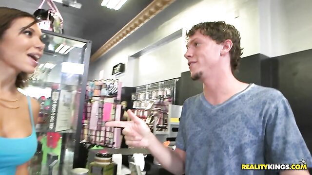 Hot brunette shopper in tight tank top flirts in sex shop