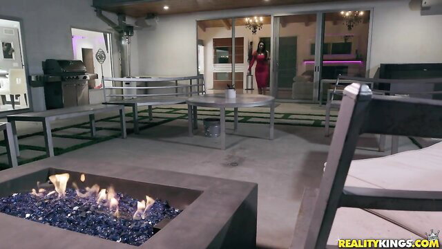 Katana Kombat in tight red dress on patio, hot MILF tease