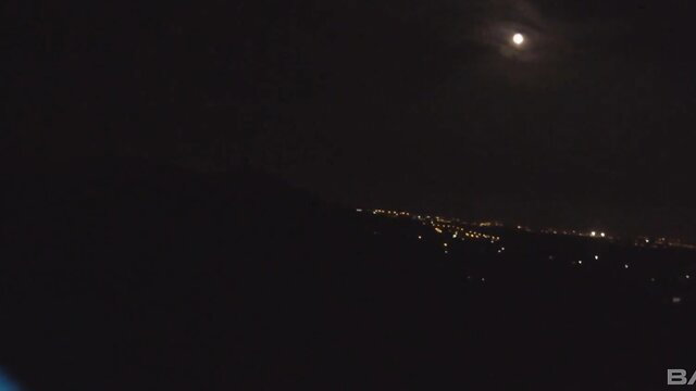Moonlit night city skyline outdoors