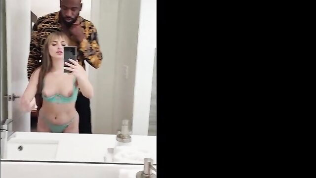 Blonde porn wife in green lingerie poses with tall ebony man behind her