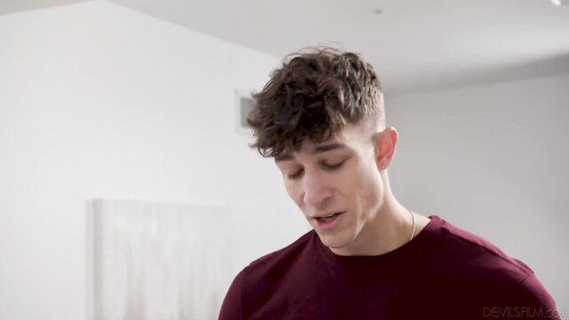Handsome brunette guy with curly hair in closeup, Leana Lovings video