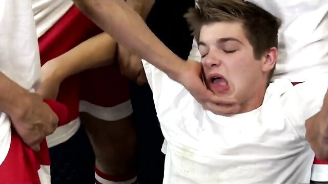 Soccer player Blade held down by teammates, mouth forced open in jock hazing