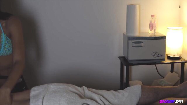 Asian babe in bikini gives shiatsu massage handjob at Shady Spa