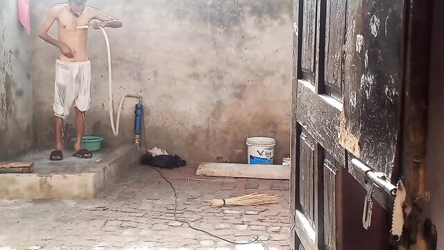 Hot Indian guy bulge in tight white shorts washing at tubewell