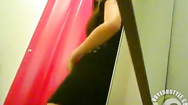 Woman in black dress trying on underwear