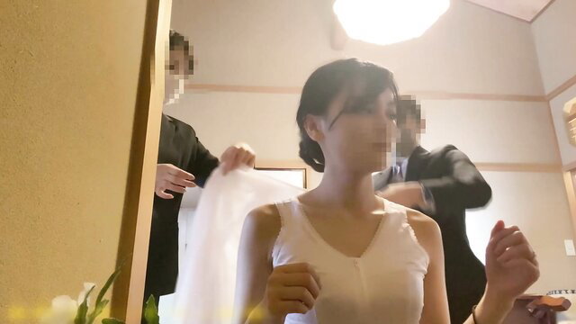 Asian bride in white dress helped into veil by suited men, wedding prep tease